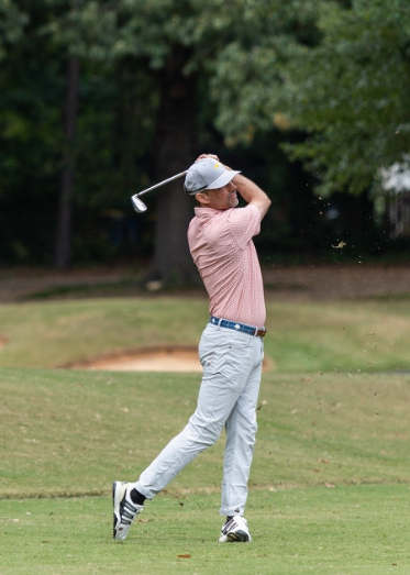 Richmond Golf Coach – On-Course Swing Golf coach at Coleman Golf Coaching in Richmond Virginia hitting an iron shot on course