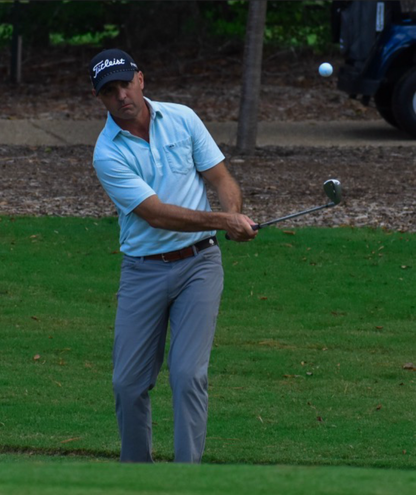 Scott – Richmond Golf Coach Demonstrating Short Game Technique Golf coach at Coleman Golf Coaching in Richmond Virginia demonstrating a chip shot during on-course instruction